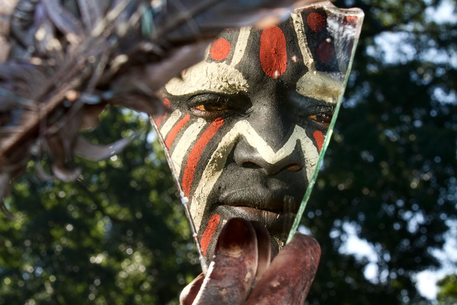 404A. Kikuyu or Gikuyu warrior preparing himself for a ceremonial dance   Kenya